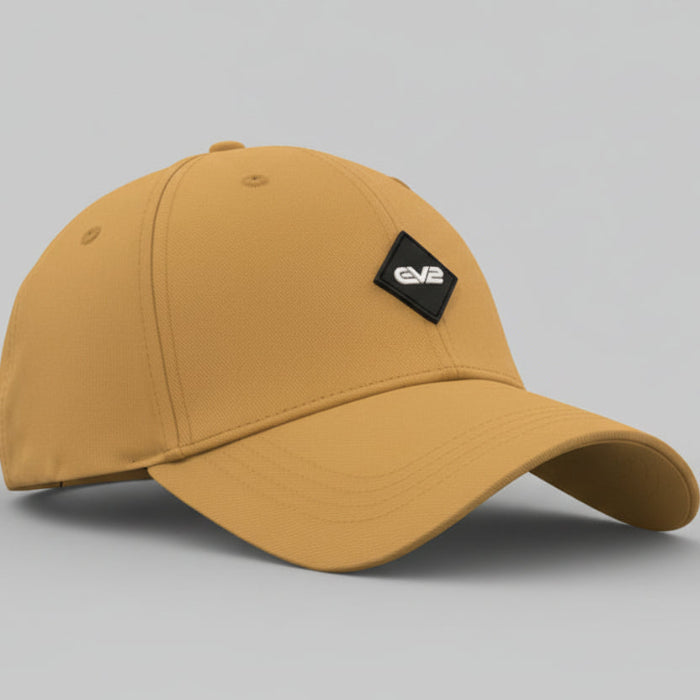 Man wearing a beige baseball cap with an EV2 logo on a white background