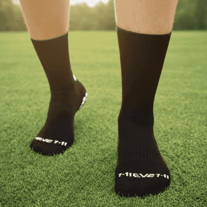 EV2 Black Grip Socks on grassy field pictured from top of the foot