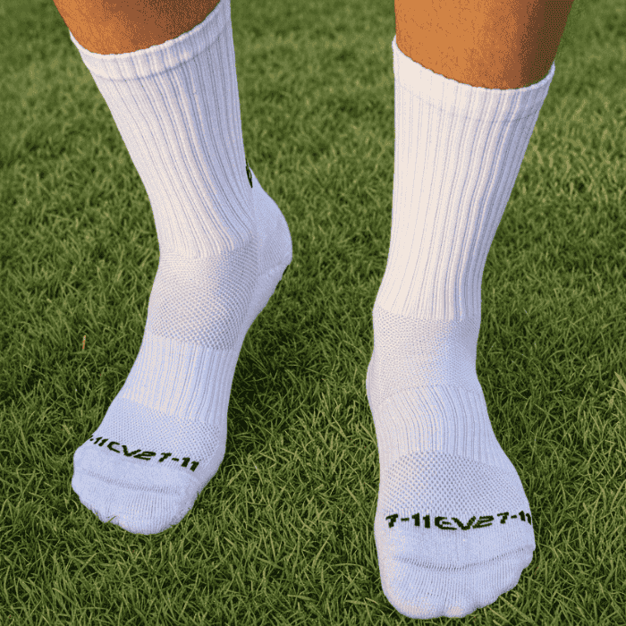 EV2 White Grip Socks on grassy field pictured from top of foot